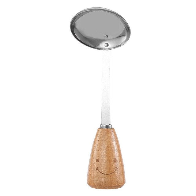 Stainless steel soup ladle with wooden handle and smiley face