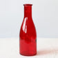 Red glass vase milk bottle shape