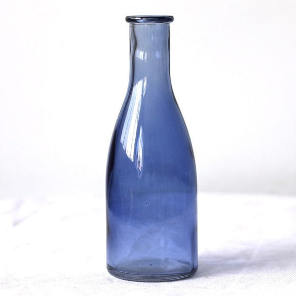 Blue glass vase milk bottle shape