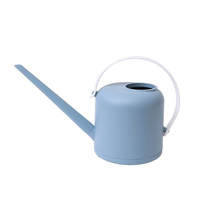 Light blue watering can with white handle