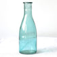 Green glass vase milk bottle shape