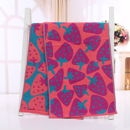 Pink and teal cotton hand or face towel with strawberry pattern