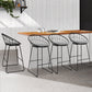 Steel bar stools with grey cushioned seating at kitchen bench