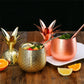 Small gold and rose copper metallic pineapple cocktail mug shown with tops off and with straws