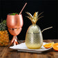 Small rose copper and gold metallic pineapple cocktail mug shown with top on and as stem stand