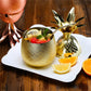 Small gold metallic pineapple cocktail mug shown with top off