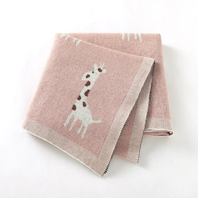 Pink cotton knit blanket with giraffes