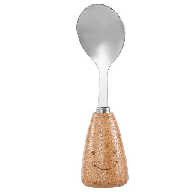 Stainless steel spoon with wooden handle and smiley face