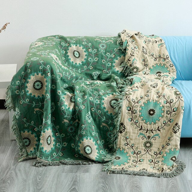 Green and cream double sided fringed throw blanket with floral design