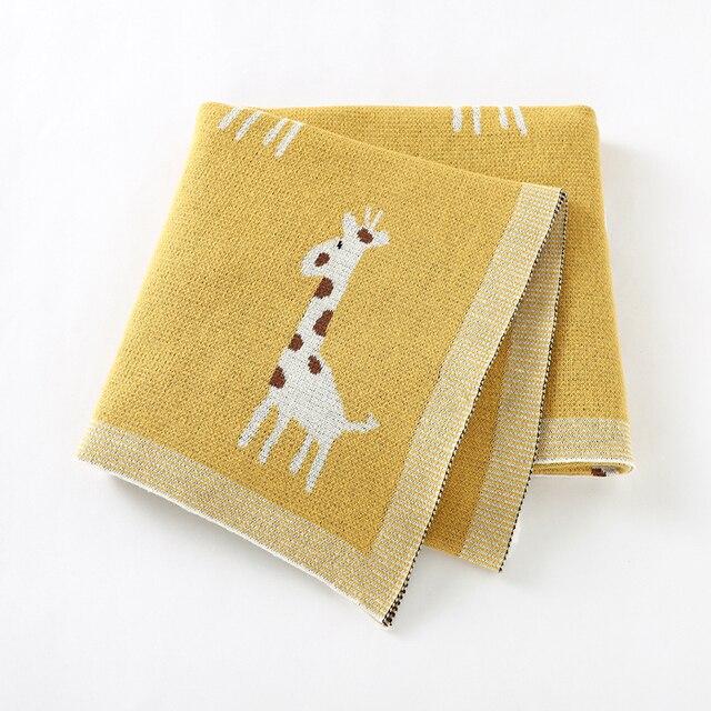 Yellow cotton knit blanket with giraffes