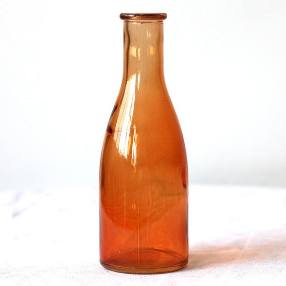 Orange glass vase milk bottle shape