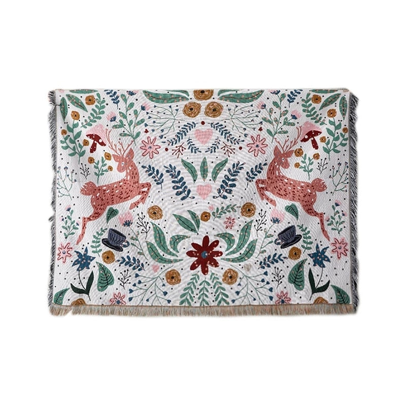 Whimsical nordic garden blanket featuring deer and flowers with fringed edge