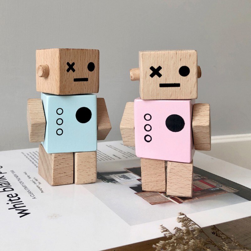 Timber wooden robots with light blue and pink painted