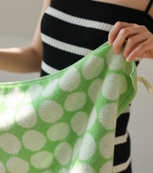 Cotton towel with green spots