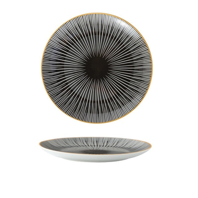 Black plate with white pattern and yellow gold edge