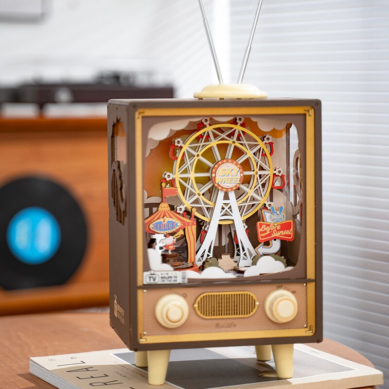 Music and light box with circus tent and ferris wheel in TV display