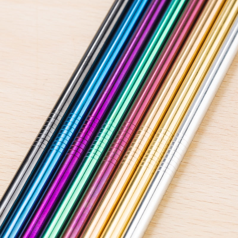 Close up of straight stainless steel straws in various colours