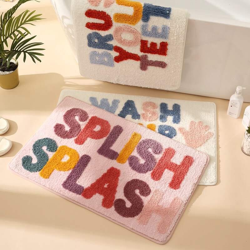 Colourful bath mats with fun messages