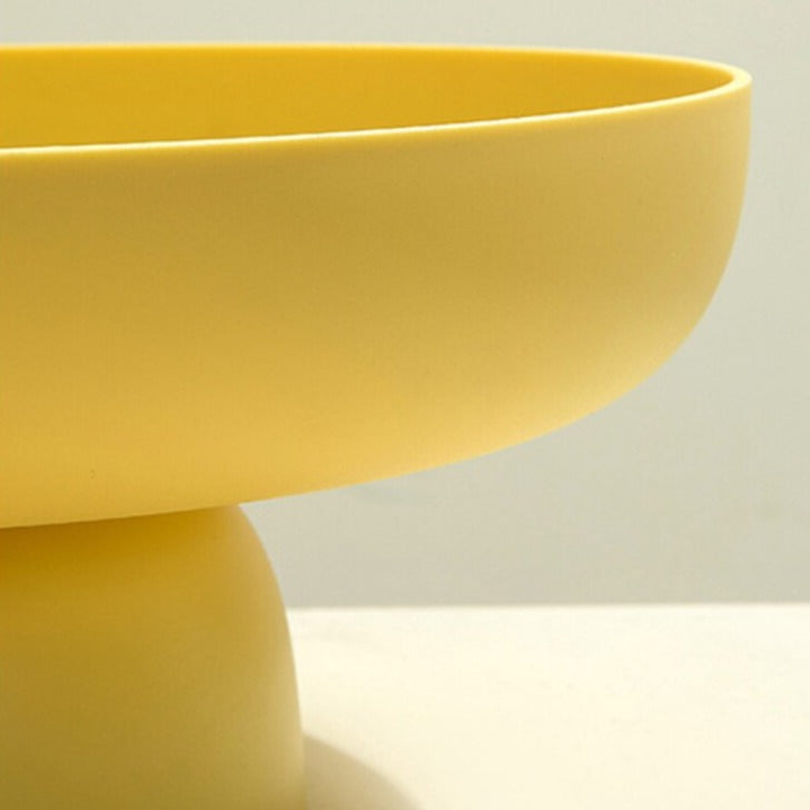 Yellow rounded elevated bowl close up