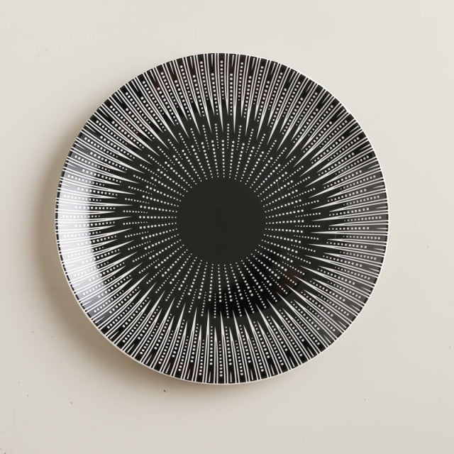 Black and white dotted burst pattern plate