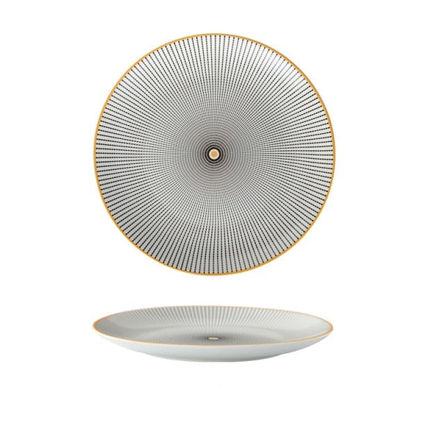 White plate with black dotted pattern and yellow centre and edge