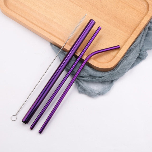 Three purple stainless steel straws with cleaning brush