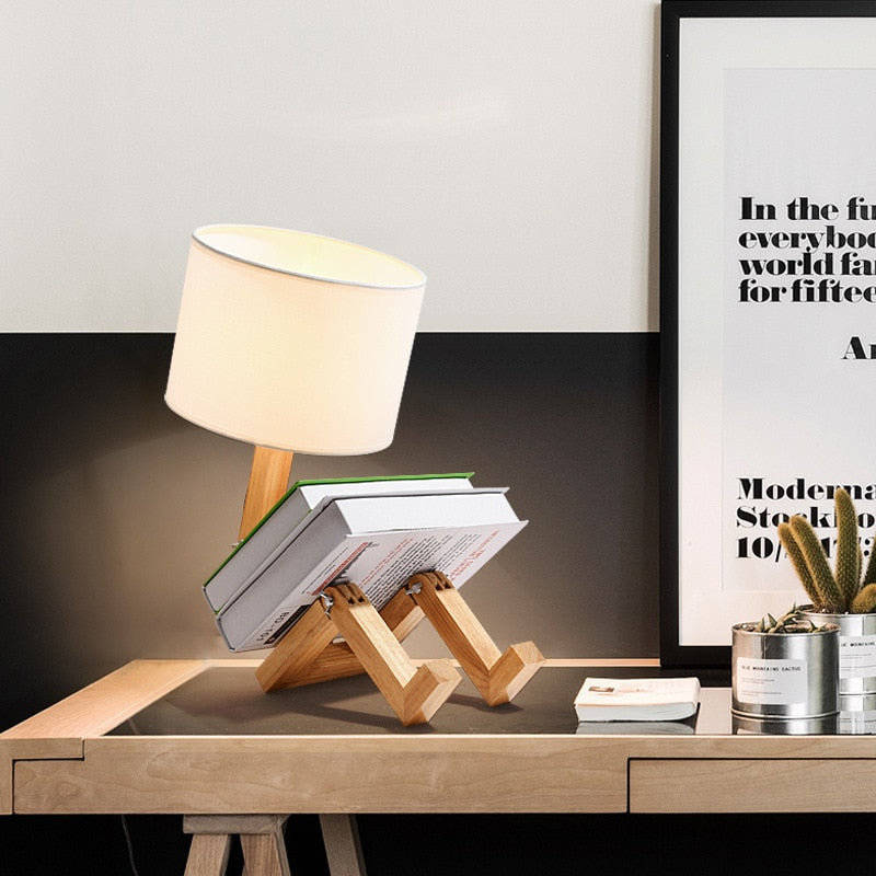 Timber robot lamp white shade sitting holding books