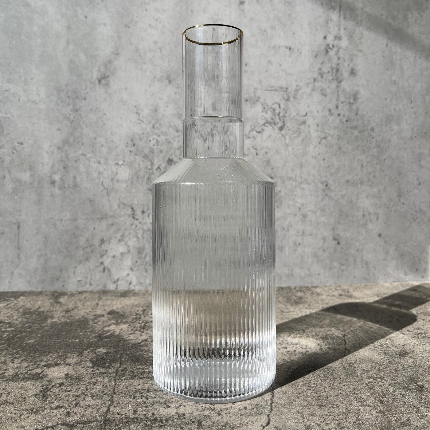 Ridged glass carafe with gold rim