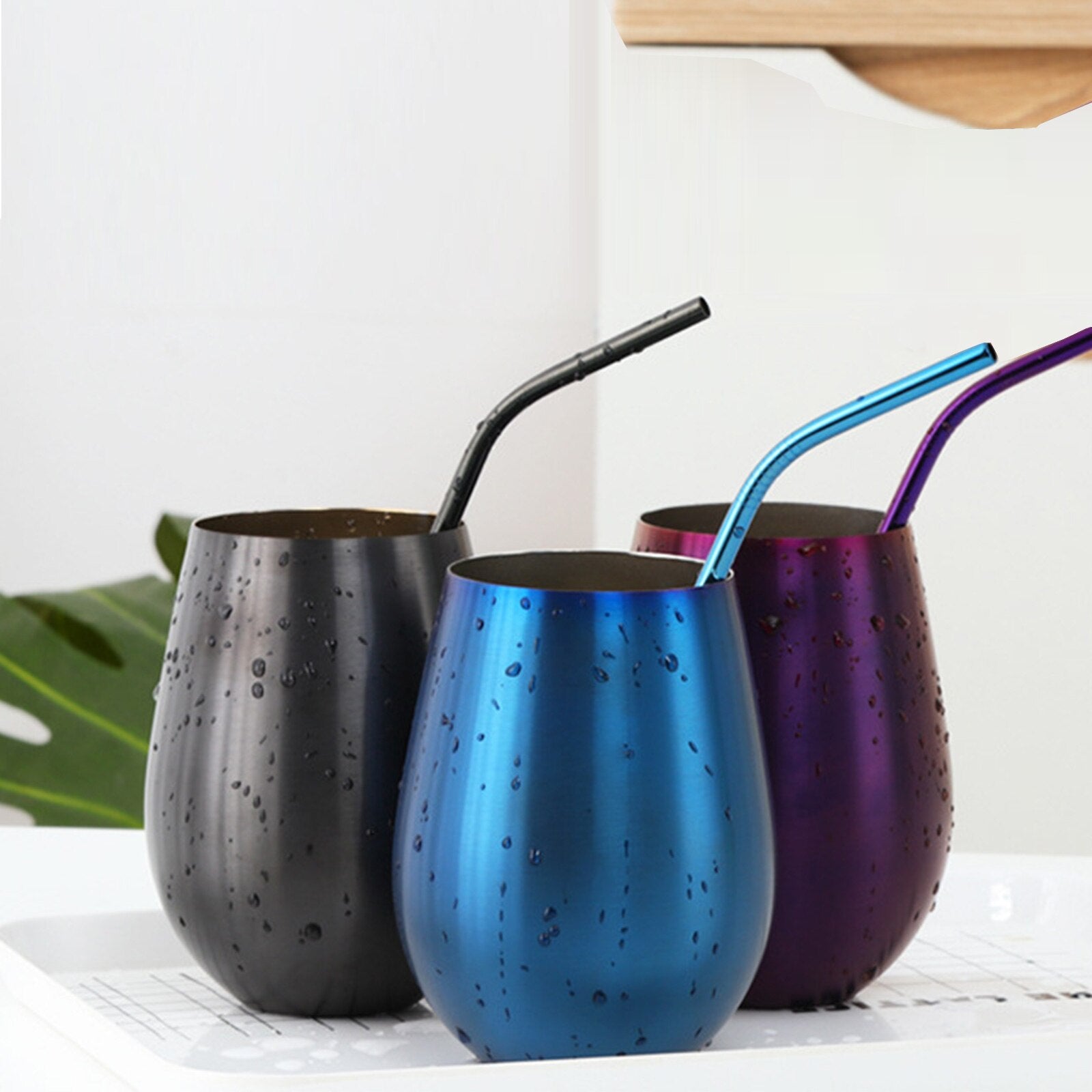 Stainless steel tumblers with straws in black blue and purple