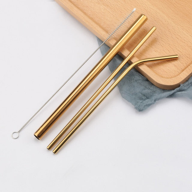 Three gold stainless steel straws with cleaning brush