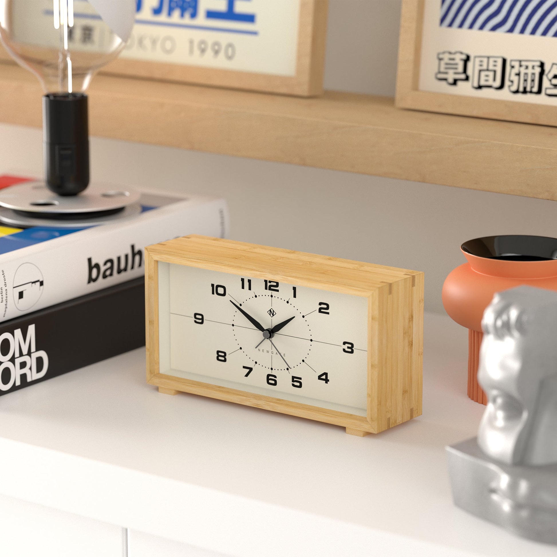 Retro inspired rectangular alarm clock made from bamboo with cream face on shelf