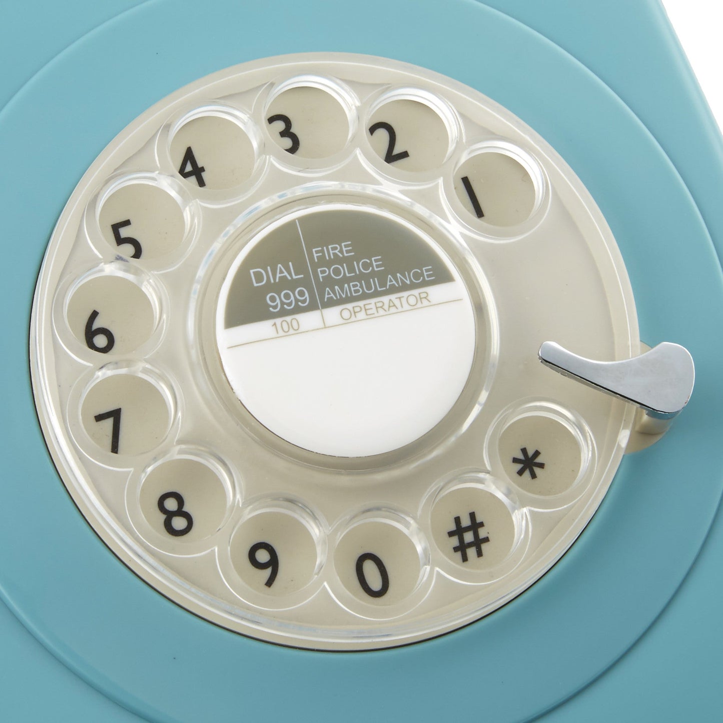 Close up of rotary dial on blue retro style working telephone