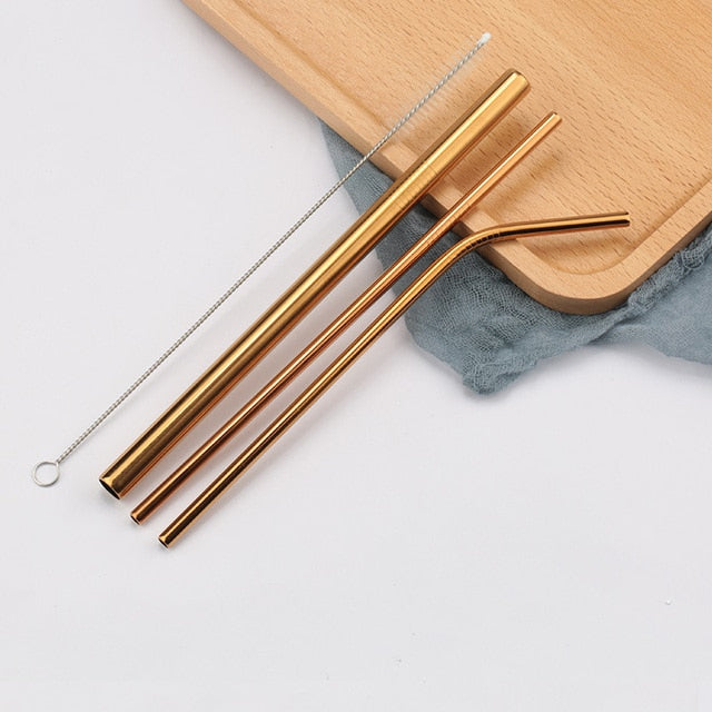 Three rose gold stainless steel straws with cleaning brush