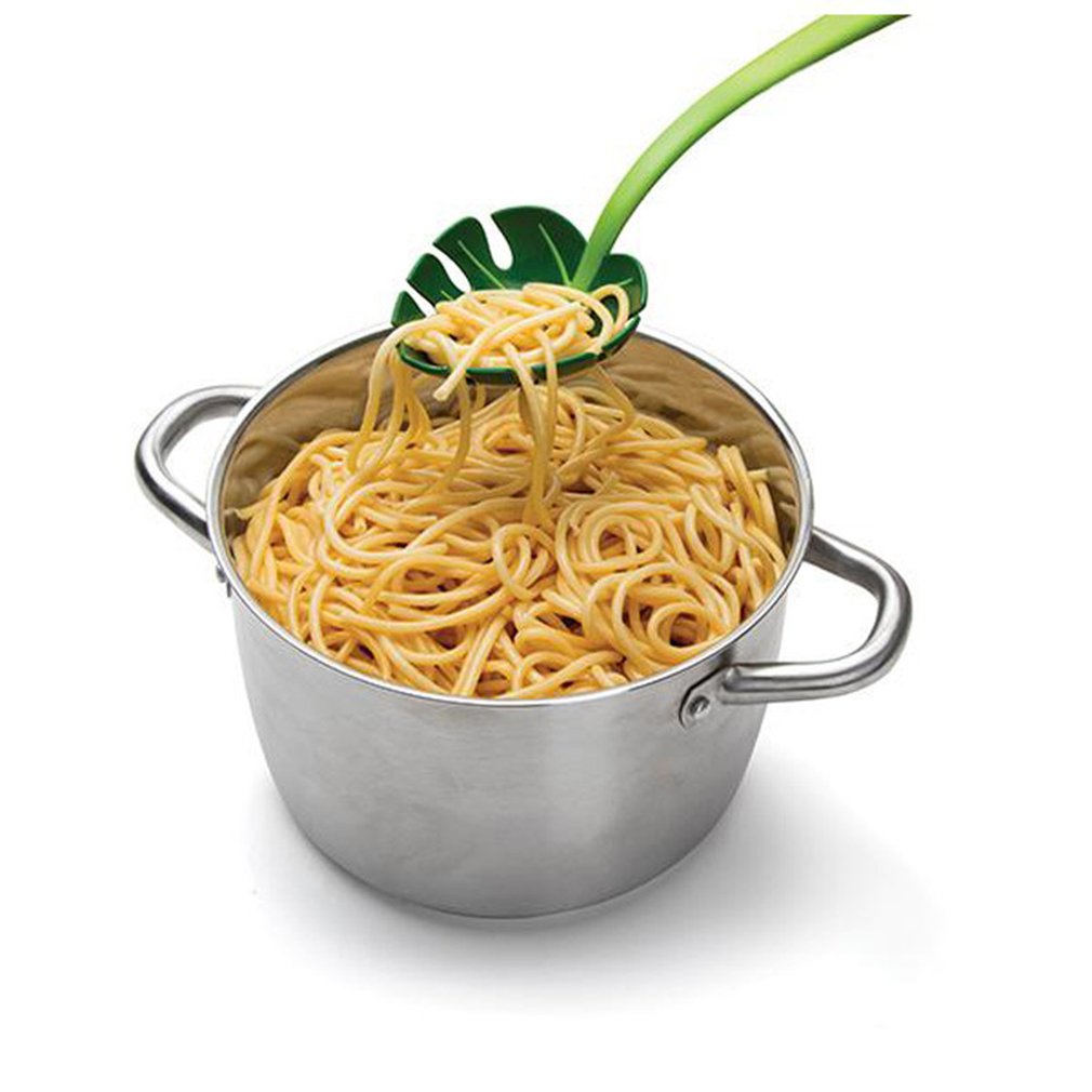 Palm leaf colander spoon with spaghetti