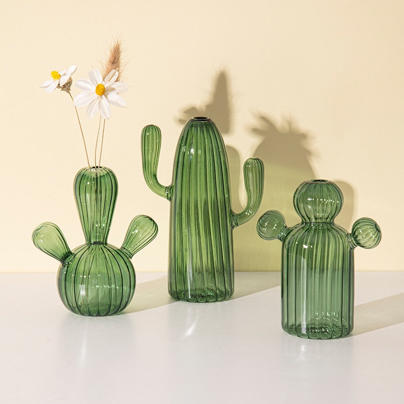 Three green glass cactus vases