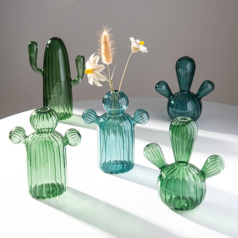 Five green and teal glass cactus vases