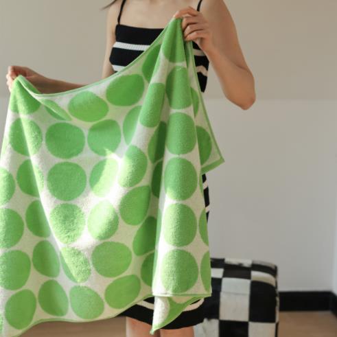 Cotton towel with green spots