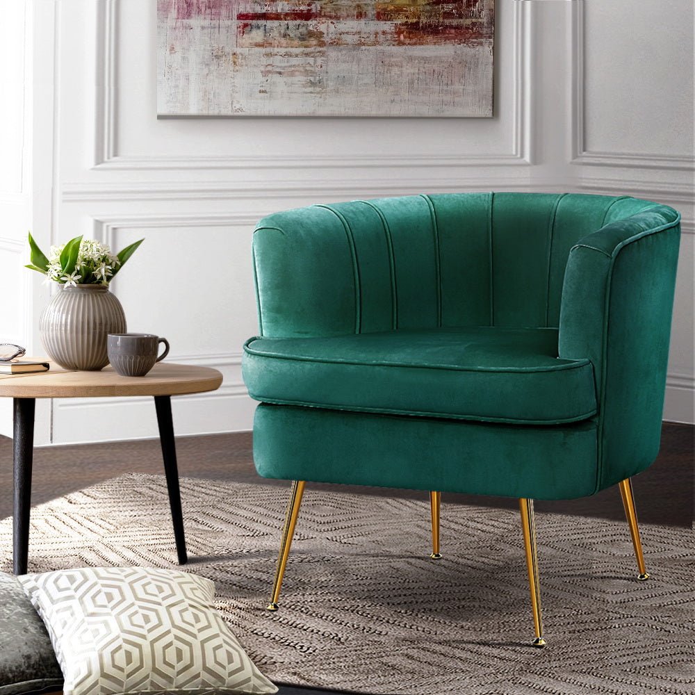 Green velvet vintage-inspired tub chair with golden legs