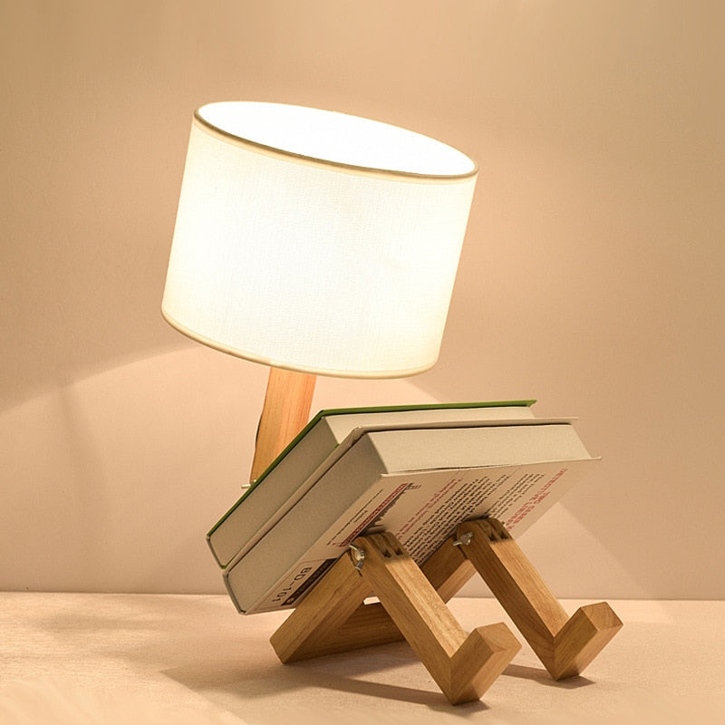 Timber robot lamp white shade sitting holding books