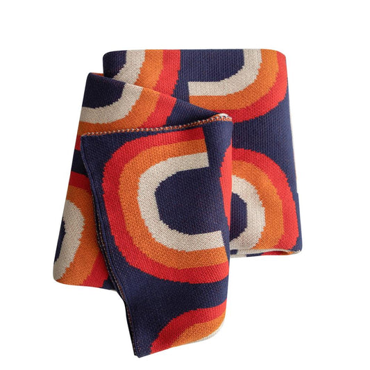 Blue red orange cream rainbow knitted blanket folded