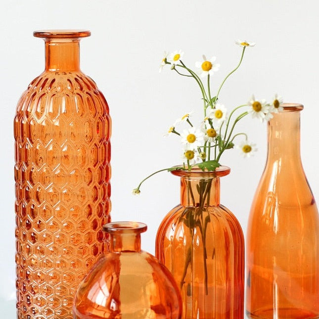 Orange vases in various shapes and sizes