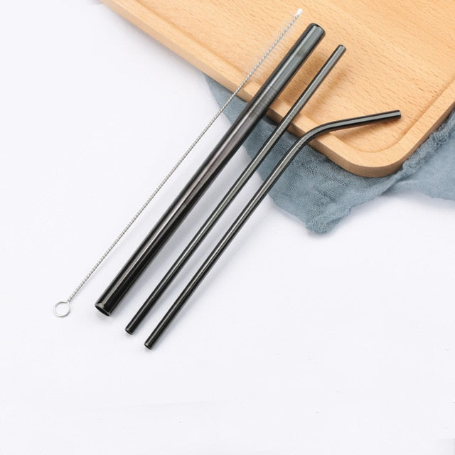 Three black stainless steel straws with cleaning brush