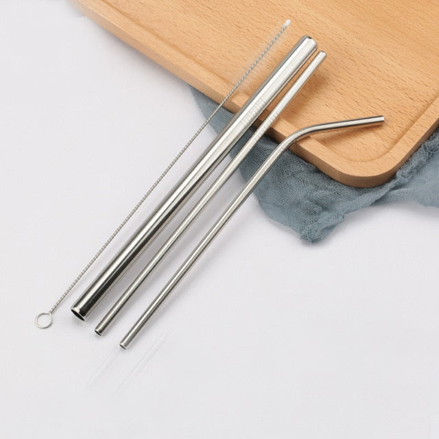 Three silver stainless steel straws with cleaning brush