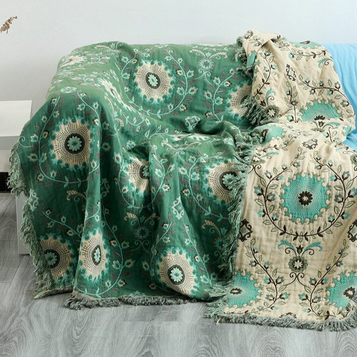 Green and cream double sided fringed throw blanket with floral design