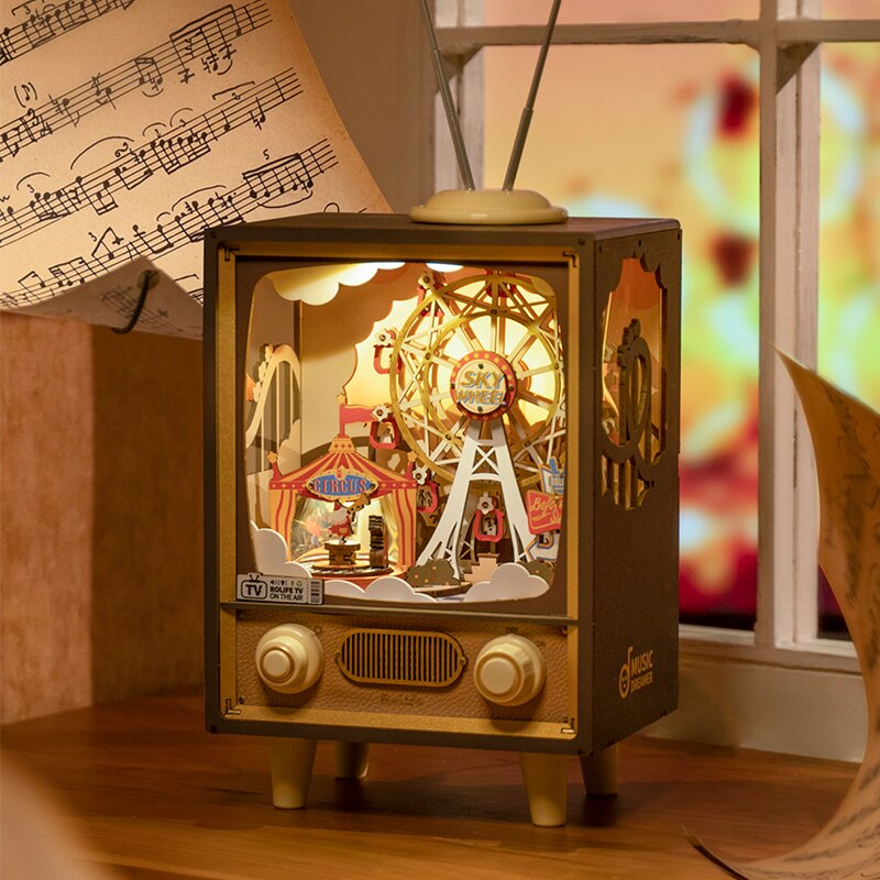 Music and light box with circus tent and ferris wheel in TV display