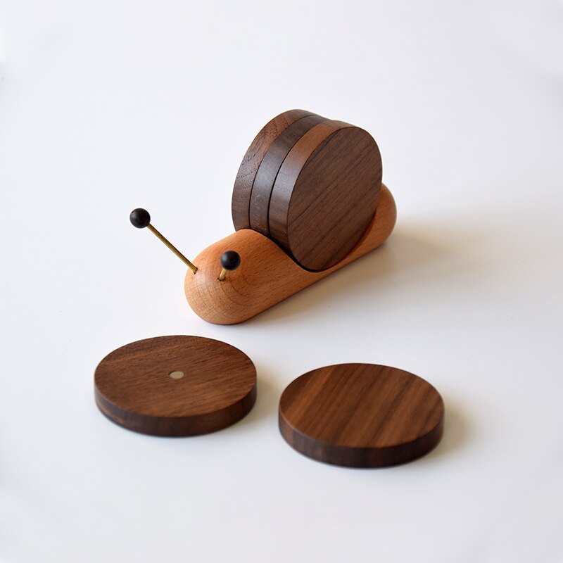 Snail coaster set showing magnetic centre of coaster