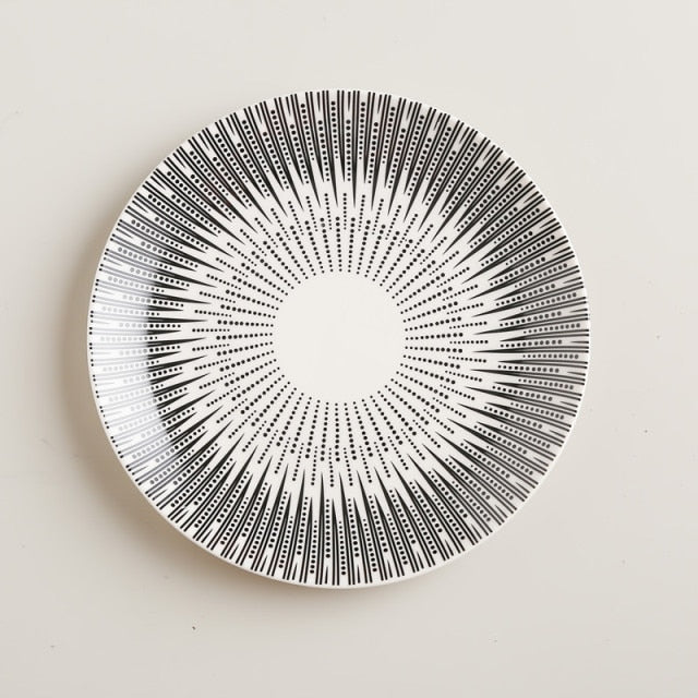 White plate with black dotted burst pattern