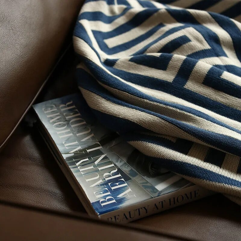 Close up of blue cream geometric throw rug