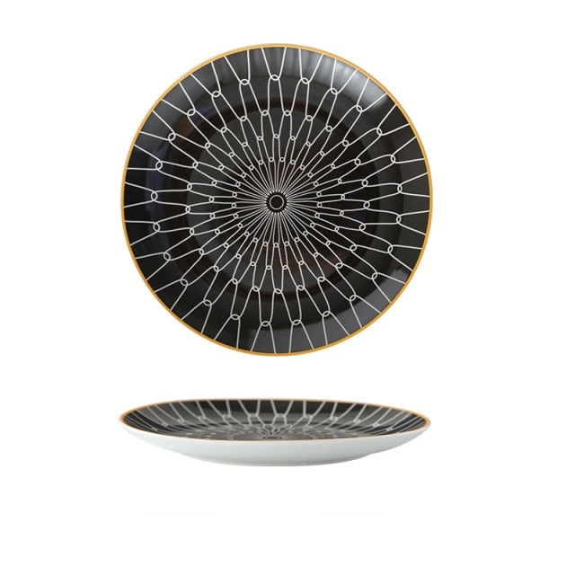 Black plate with white pattern and yellow gold edge