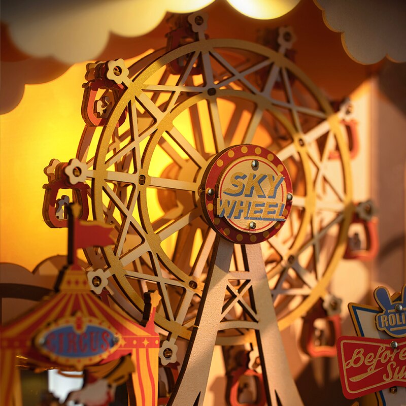 Close up of music and light box with circus tent and ferris wheel in TV display